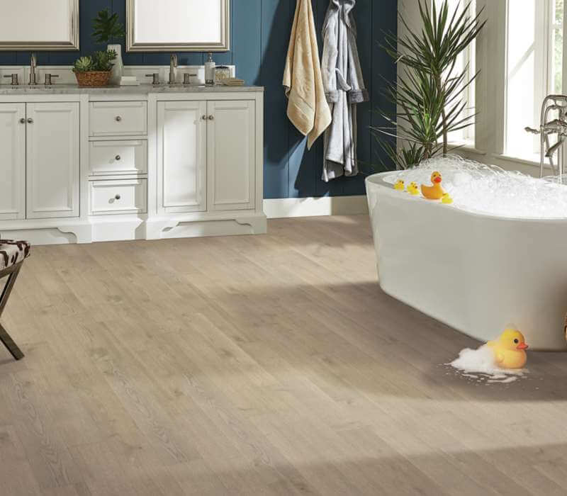 Hardwood flooring in bathroom | Dehart Tile