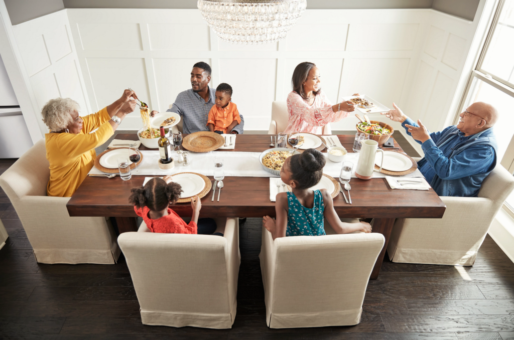 Family having breakfast at the dining table | Dehart Tile